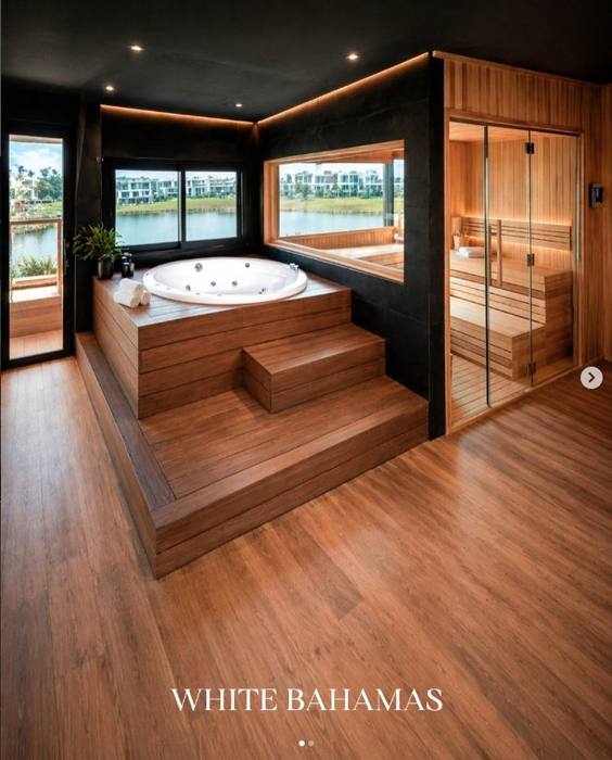 Wellness suite con jacuzzi redondo y sauna panorámica